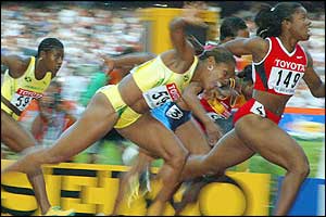 Canada's Perdita Felicien is a surprise winner of the women's 100m hurdles final ahead of Jamaican favourite Brigitte Foster
