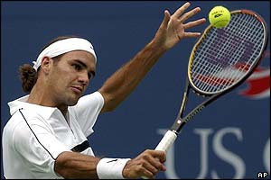 Federer returns a backhand as he takes the second set