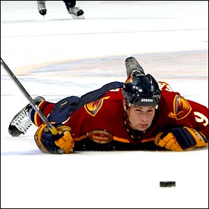 The Atlanta Thrashers' Marc Savage takes a tumble during a NHL match