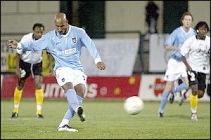 Man City's Nicolas Anelka takes a penalty 