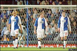 Blackburn's players walk back to the centre circle after conceding a goal