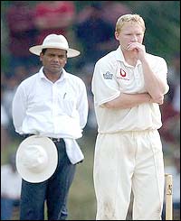 England's Gareth Batty looks deep in thought after bowling a delivery