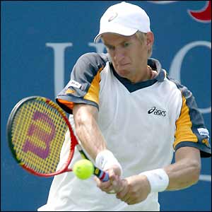 Finland's Jarkko Nieminen returns the ball