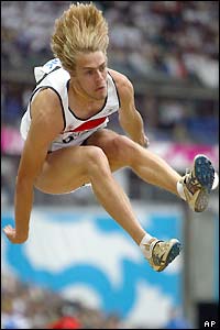 Chris Tomlinson jumps during qualifying for the long jump final