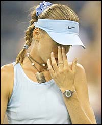 Slovakia's Daniela Hantuchova wipes her eye 