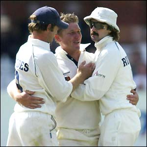 Gloucestershire's Jack Russell celebrates with team-mates after stumping Worcestershire's Matthew Mason