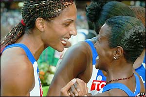 Christine Arron of France and teammate Patricia Girard celebrate