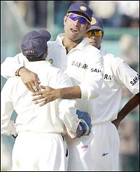 Parthiv Patel (left) is congratulated by VVS Laxman