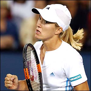 French Open champion Justine Henin-Hardenne celebrates after beating Japan's Saori Obata 