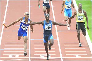 Jerome Young (centre) crosses the line to win the 4x400m relay for the US ahead of France's Marc Raquil (left)