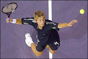 Spain's Juan Carlos Ferrero serves against Paradorn Srichaphan at the Madrid Masters