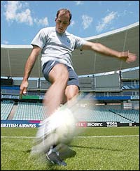 Irish fullback Girvan Dempsey practices kicking during training 