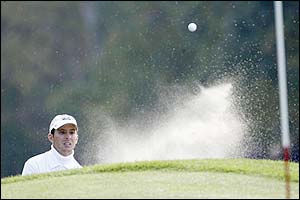 Canada's Mike Weir plays a bunker shot