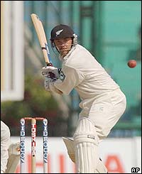 New Zealand's Craig McMillan sets himself to play a drive