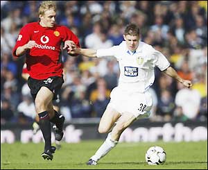 Youngster James Milner runs away with the ball