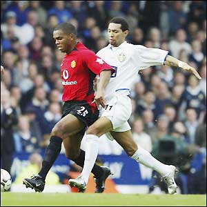 Leeds' Jermaine Pennant tackles Quinton Fortune