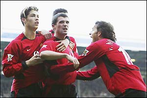 Roy Keane celebrates scoring the winning goal