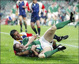 John Kelly charges over the tryline