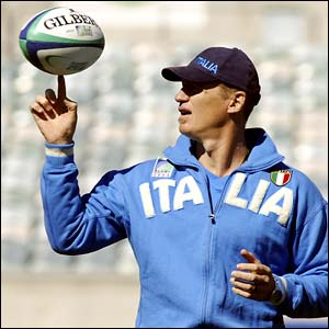 Italy's former All Black coach John Kirwan spins a ball during team training for the Rugby World Cup 2003
