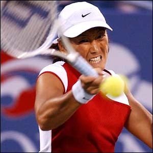Ai Sugiyama of Japan hits a forehand return to Francesca Schiavone of Italy 