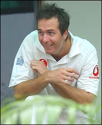 England captain Michael Vaughan ducks to avoid the rain