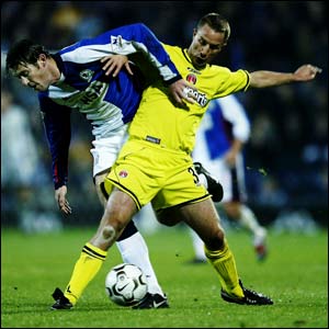Brett Emerton of Blackburn and Charlton's Chris Perry compete for the ball during Monday night's Premiership clash