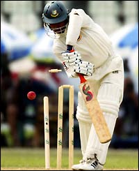 Bangladesh's Hakkan Sarkar is bowled out