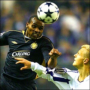Didier Agathe of Celtic heads the ball away from Olivier Deschacht during their 1-0 Champions League defeat to Anderlecht
