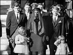 JFK Jnr saluting after the funeral service