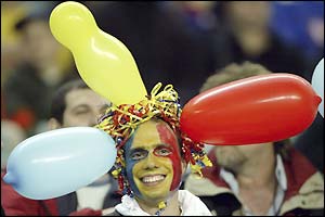 A Romanian fan watches the game