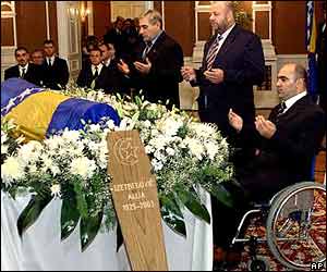 Bosnians pray over body of Izetbegovic as he lies in state surrounded by flowers