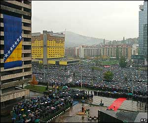 Thousands gather in front of Bosnian Parliament for memorial service for former Bosnian President Alija Izetbegovic 