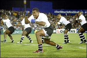 Fiji players led by Kele Leawere perform their version of the Haka