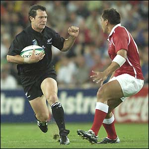 Leon MacDonald runs at the Tongan defence