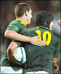 Derick Hougaard (right) is congratulated on his try - South Africa's second