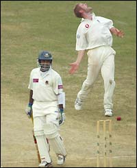 Javed Omar leaves the pitch after being adjudged lbw to England's Matthew Hoggard