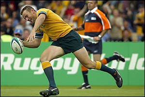 Chris Latham goes over in the third minute to score Australia's first try