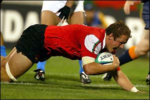 Dafydd Jones crosses the line for his first international try