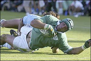 Quinlan suffers a suspected dislocated shoulder as he is tackled on the line 