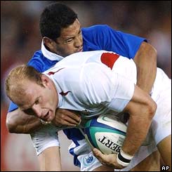 Lawrence Dallaglio of England is tackled by Samoa's Earl Va'a 