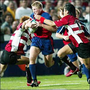 The USA's scrum-half Kevin Dalzell charges the Japan defence