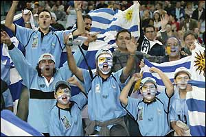 The Uruguay fans celebrate their team's 24-12 win over Georgia