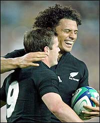 Steve Devine congratulates Doug Howlett on his try