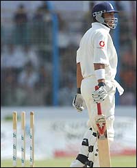 Mark Butcher of England leaves the pitch after being dismissed