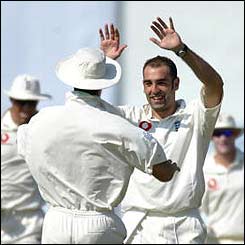 England's Richard Johnson celebrates taking the first wicket 