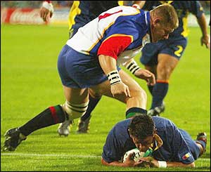 Romania's scrum-half Lucian Sirbu scores the second try