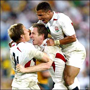 Jonny Wilkinson, Will Greenwood and Jason Robinson celebrate victory in the World Cup final