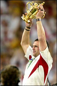 Skipper Martin Johnson finally gets his hands on the ultimate prize and lifts the Webb Ellis trophy