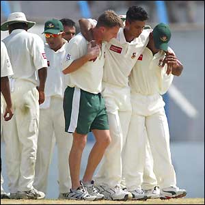 Bangladeshi fast bowler Mashrafe Mortaza is helped from the field with a knee injury