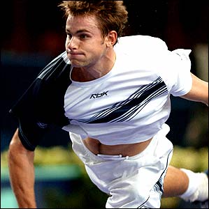 Andy Roddick of the US serves to Tommy Robredo of Spain during his third round victory at the Paris Masters tournament at Bercy
